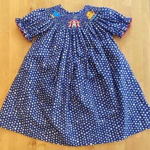 Southern Sunshine brand smocked circus themed dress. NWOT tags. Size 2
